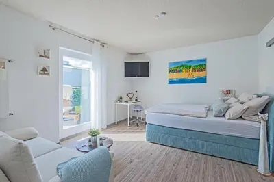 Ein Bett oder Betten in einem Zimmer der Unterkunft Park Hotel