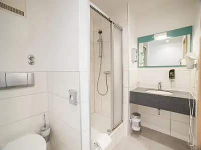 Ein Badezimmer in der Unterkunft Park Hotel