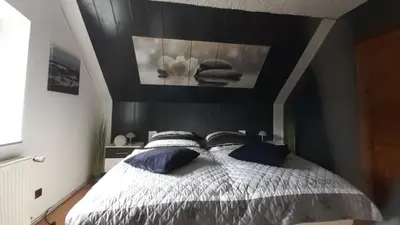 Ein Bett oder Betten in einem Zimmer der Unterkunft Ferienwohnung Am Vulkanpfad