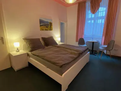 Ein Bett oder Betten in einem Zimmer der Unterkunft Weinzeit Kröv