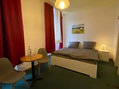 Ein Bett oder Betten in einem Zimmer der Unterkunft Weinzeit Kröv