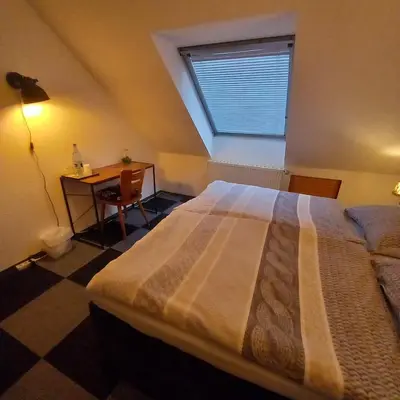 Ein Bett oder Betten in einem Zimmer der Unterkunft Zur alten Metzgerei