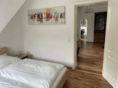 Ein Bett oder Betten in einem Zimmer der Unterkunft FEWO Hühnerberg Weingut C.A. Haussmann