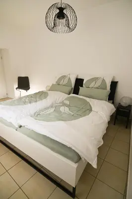 Ein Bett oder Betten in einem Zimmer der Unterkunft Moselglück Winningen