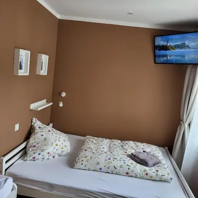 Ein Bett oder Betten in einem Zimmer der Unterkunft Haus Valentonio
