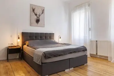 Ein Bett oder Betten in einem Zimmer der Unterkunft Vintage Apartment 1 am Kurpark von Bad Ems