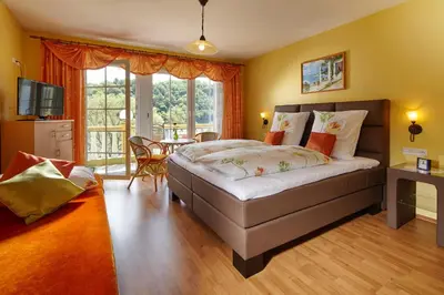 Ein Bett oder Betten in einem Zimmer der Unterkunft Panorama Hotel & Restaurant