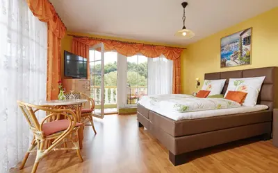 Ein Bett oder Betten in einem Zimmer der Unterkunft Panorama Hotel & Restaurant