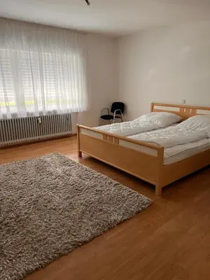 Ein Bett oder Betten in einem Zimmer der Unterkunft Ferien am Maar