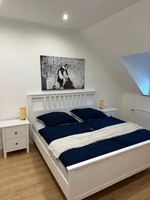 Ein Bett oder Betten in einem Zimmer der Unterkunft Stadthaus Apartment Bachperle