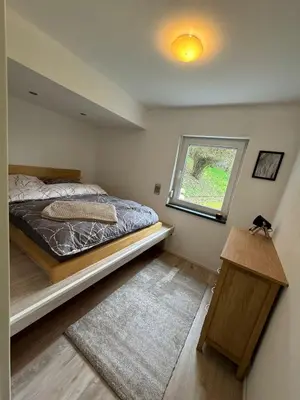 Ein Bett oder Betten in einem Zimmer der Unterkunft Ferienhaus Wald&Wiese