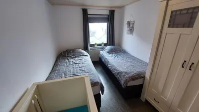 Ein Bett oder Betten in einem Zimmer der Unterkunft Feriënhaus Hohe Acht
