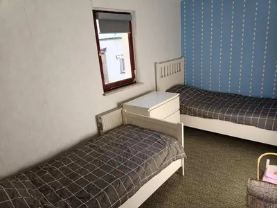 Ein Bett oder Betten in einem Zimmer der Unterkunft Feriënhaus Hohe Acht