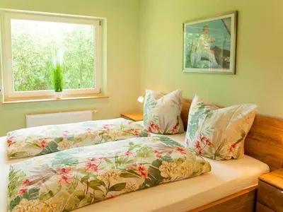 Ein Bett oder Betten in einem Zimmer der Unterkunft Ferienhaus Maring