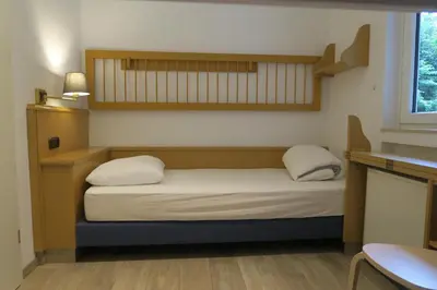 Ein Bett oder Betten in einem Zimmer der Unterkunft Landhaus am See 934