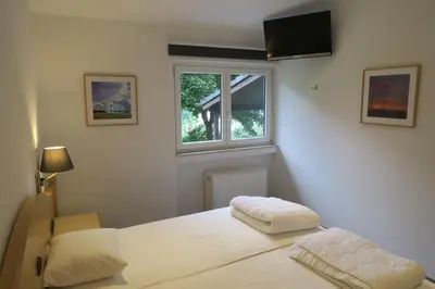Ein Bett oder Betten in einem Zimmer der Unterkunft Landhaus am See 934