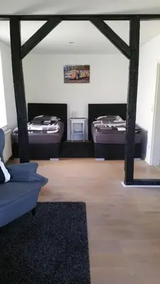 Ein Bett oder Betten in einem Zimmer der Unterkunft Hinter'm Mäuerchen