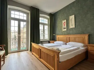 Ein Bett oder Betten in einem Zimmer der Unterkunft Nostalgie Altstadthotel Kornpforte
