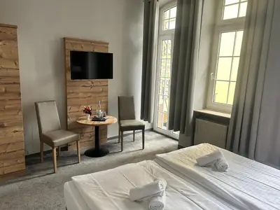 Ein Bett oder Betten in einem Zimmer der Unterkunft Nostalgie Altstadthotel Kornpforte