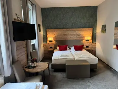 Ein Bett oder Betten in einem Zimmer der Unterkunft Nostalgie Altstadthotel Kornpforte