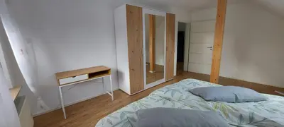Ein Bett oder Betten in einem Zimmer der Unterkunft Haus Erika