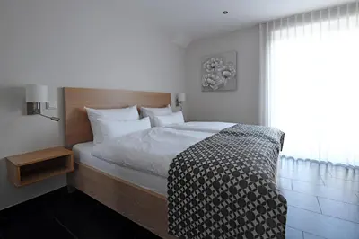 Ein Bett oder Betten in einem Zimmer der Unterkunft Weingut Heinen