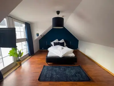Ein Bett oder Betten in einem Zimmer der Unterkunft Design Wohnung nähe Uni