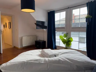 Ein Bett oder Betten in einem Zimmer der Unterkunft Design Wohnung nähe Uni