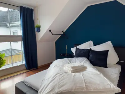Ein Bett oder Betten in einem Zimmer der Unterkunft Design Wohnung nähe Uni