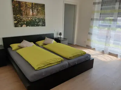 Ein Bett oder Betten in einem Zimmer der Unterkunft Weingut u. Gästehaus Becker