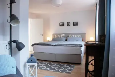 Ein Bett oder Betten in einem Zimmer der Unterkunft LUX Ferienwohnung im Weinort Pommern an der Mosel