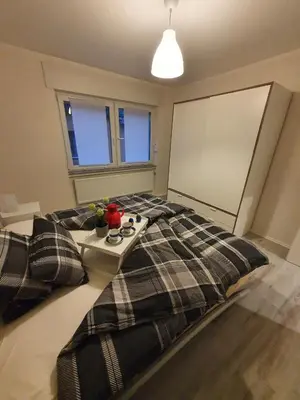 Ein Bett oder Betten in einem Zimmer der Unterkunft Ferienwohnung an der Mosel, Julia