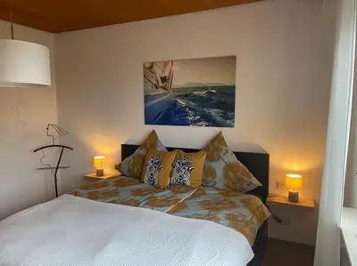 Ein Bett oder Betten in einem Zimmer der Unterkunft Ferienwohnung Seebrise Bostalsee