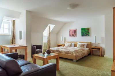 Ein Bett oder Betten in einem Zimmer der Unterkunft Zum Simonbräu