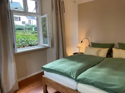 Ein Bett oder Betten in einem Zimmer der Unterkunft Altes Winzerhaus Lenz