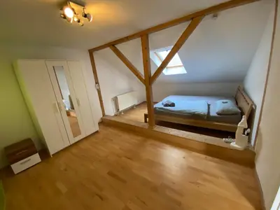 Ein Bett oder Betten in einem Zimmer der Unterkunft Ferienhaus Mama Rhein - 134mq