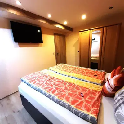 Ein Bett oder Betten in einem Zimmer der Unterkunft NEU! 3 Sterne Ferienwohnung Loreley DTV Klassifizierung