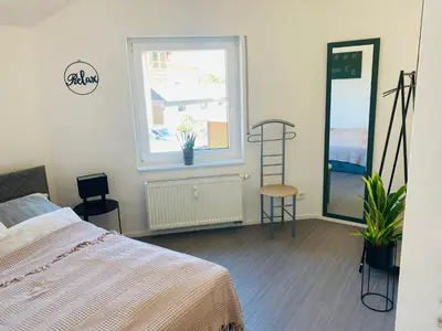 Ein Bett oder Betten in einem Zimmer der Unterkunft Ferienwohnung Am Maarbach