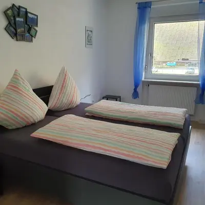 Ein Bett oder Betten in einem Zimmer der Unterkunft Ferienwohnung Nina