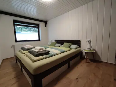 Ein Bett oder Betten in einem Zimmer der Unterkunft Ferienwohnung 'Unter der Burg'