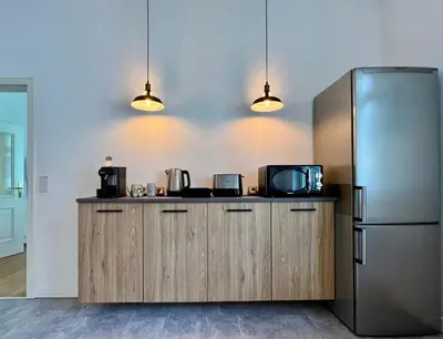 Küche/Küchenzeile in der Unterkunft VonMos City Apartments