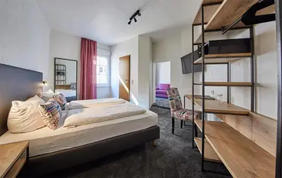 Ein Bett oder Betten in einem Zimmer der Unterkunft Gästehaus Zur Traube