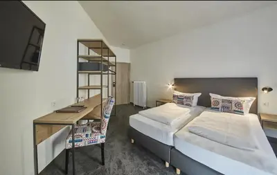 Ein Bett oder Betten in einem Zimmer der Unterkunft Gästehaus Zur Traube