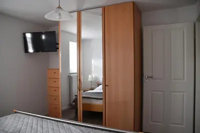 Ein Bett oder Betten in einem Zimmer der Unterkunft Ferienwohnung-Naurath