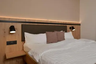 Ein Bett oder Betten in einem Zimmer der Unterkunft Hotel zur Post 3 Sterne S Altenahr