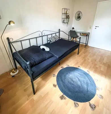 Ein Bett oder Betten in einem Zimmer der Unterkunft Gemütliche Ferienwohnung für 4 Personen
