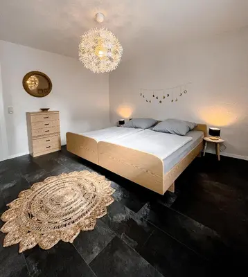 Ein Bett oder Betten in einem Zimmer der Unterkunft Gemütliche Ferienwohnung für 4 Personen