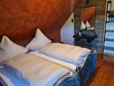 Ein Bett oder Betten in einem Zimmer der Unterkunft Western Cottage Hocheifel