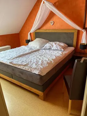Ein Bett oder Betten in einem Zimmer der Unterkunft Ferienhaus Scheid