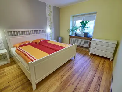 Ein Bett oder Betten in einem Zimmer der Unterkunft Ferienwohnung Grüner Flamingo
